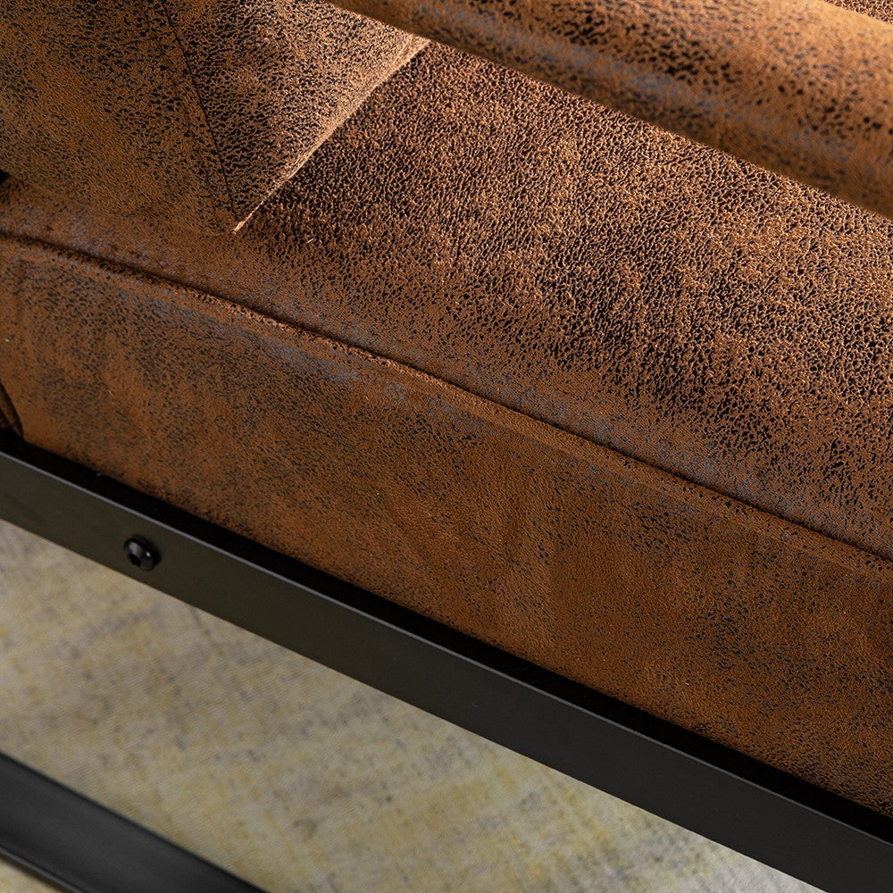 Closeup of distressed brown faux leather sofa cushion with black metal frame