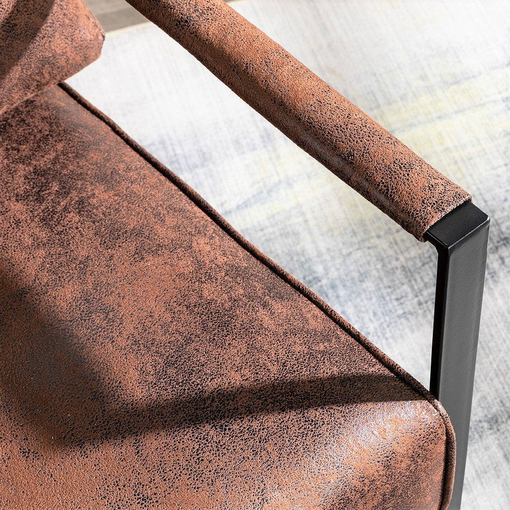 Brown distressed faux leather accent chair with black metal frame