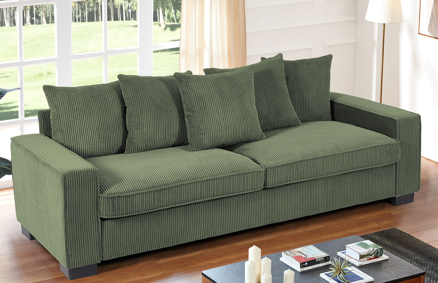 Olive green corduroy sofa with four plush cushions and wooden floor