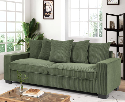 Green corduroy threeseater sofa with plush cushions