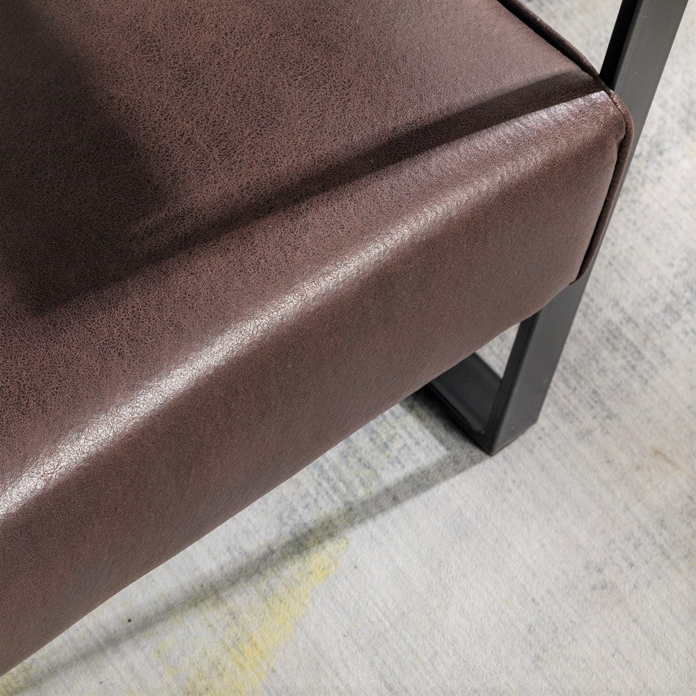 Closeup of textured brown faux leather bench cushion