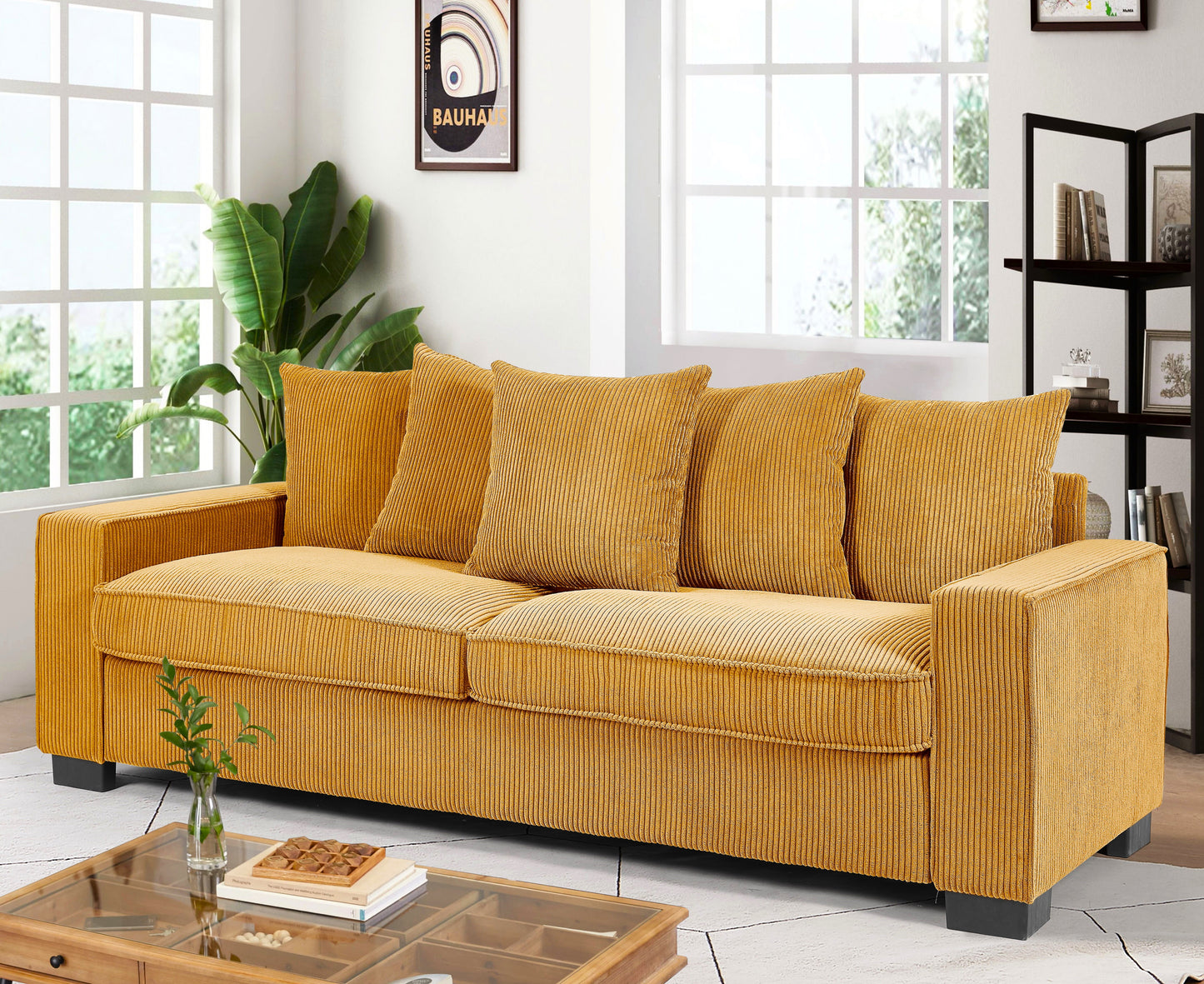Mustard yellow corduroy sofa with plush cushions and wooden frame