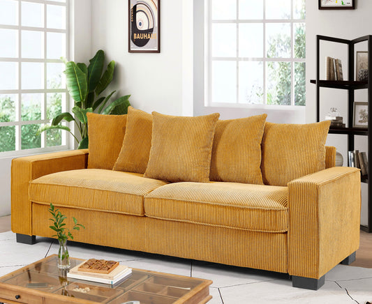 Mustard yellow corduroy sofa with plush cushions and wooden frame