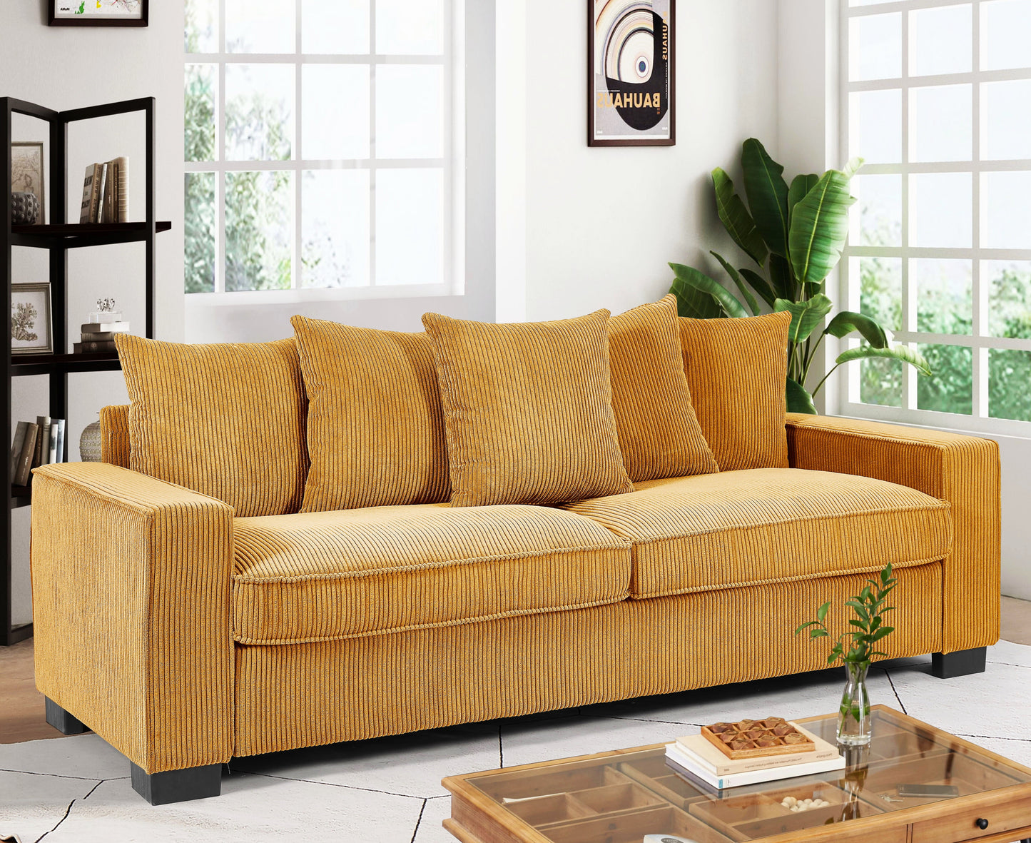 Mustard yellow corduroy sofa with plush cushions and modern black legs