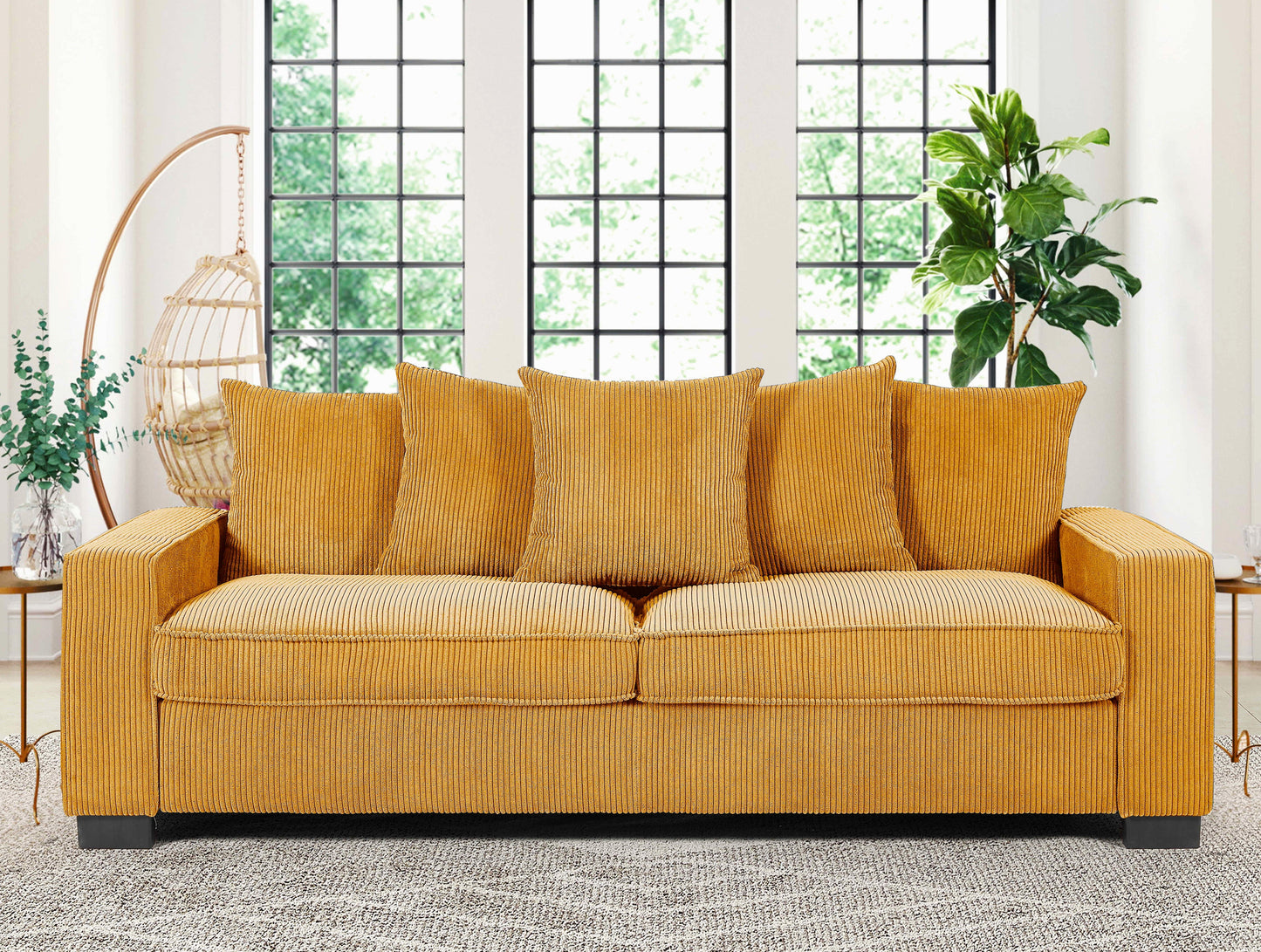 Mustard yellow corduroy sofa with plush cushions ideal for a living room