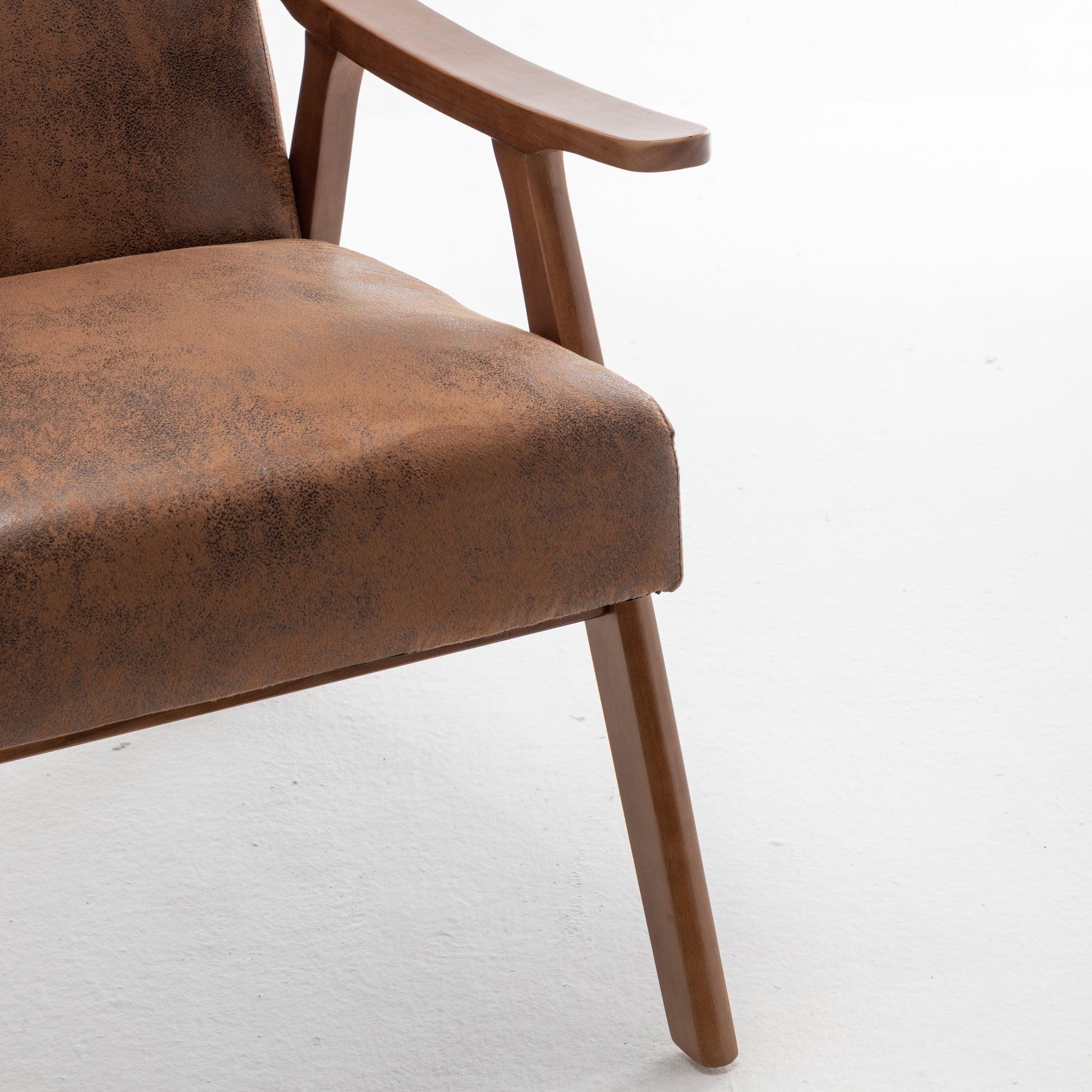 Brown suede accent chair with wooden legs and armrests