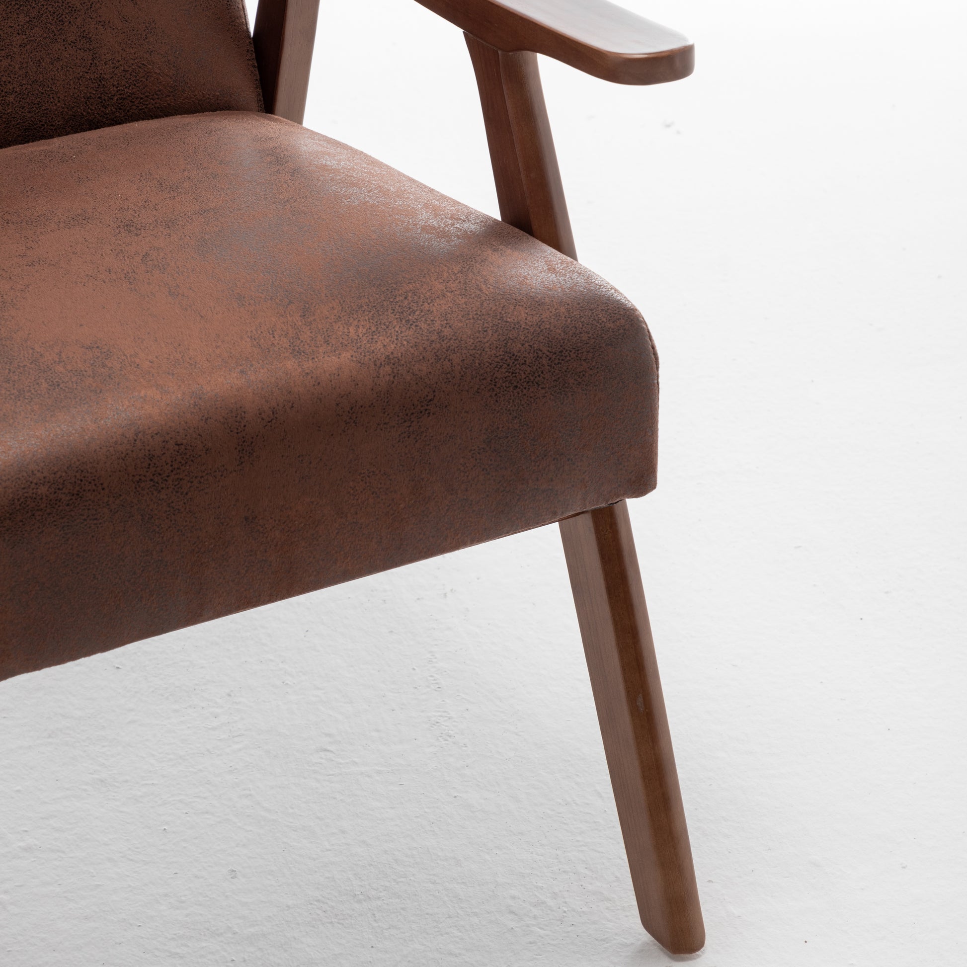 Brown faux suede armchair seat with wooden armrest and leg detail