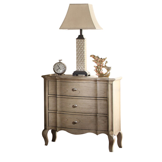 Light oak finish threedrawer nightstand with ornate curved legs