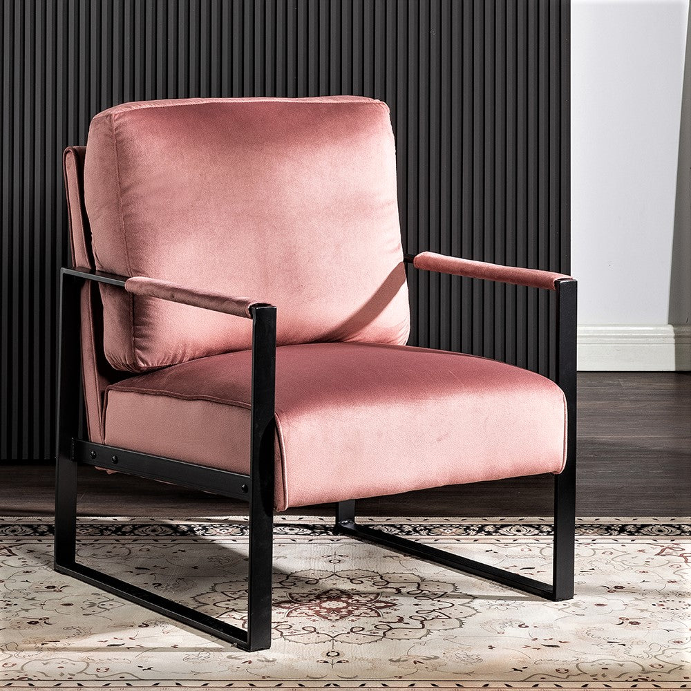 Dusty rose velvet accent chair with black metal frame and armrests