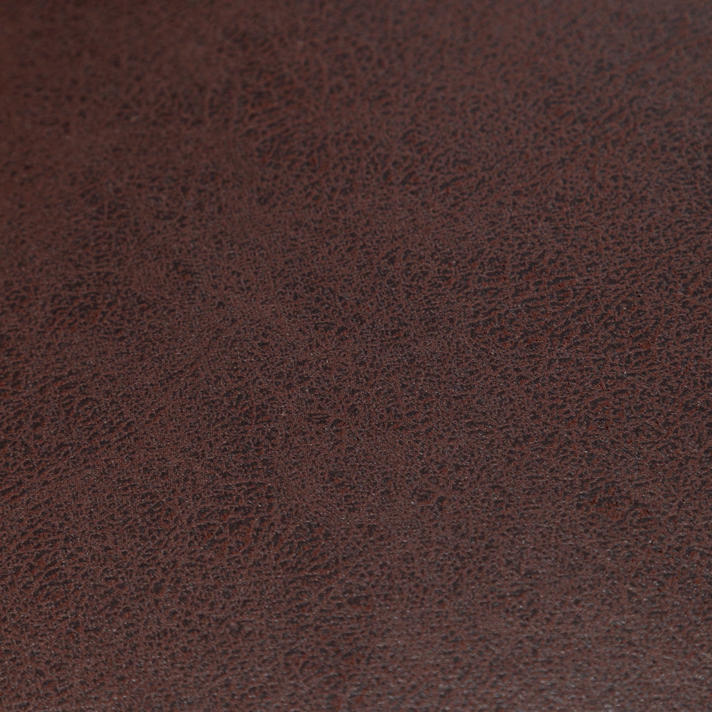 Dark brown textured faux leather swatch