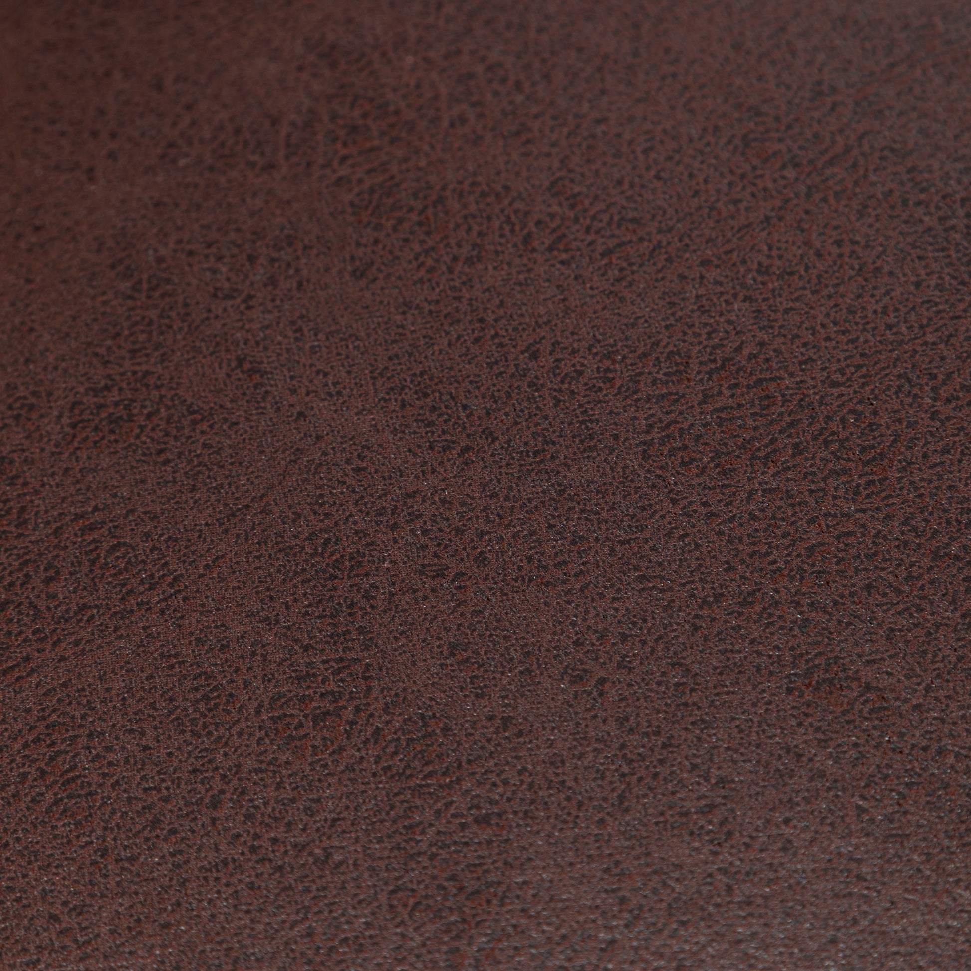 Dark brown textured faux leather upholstery fabric