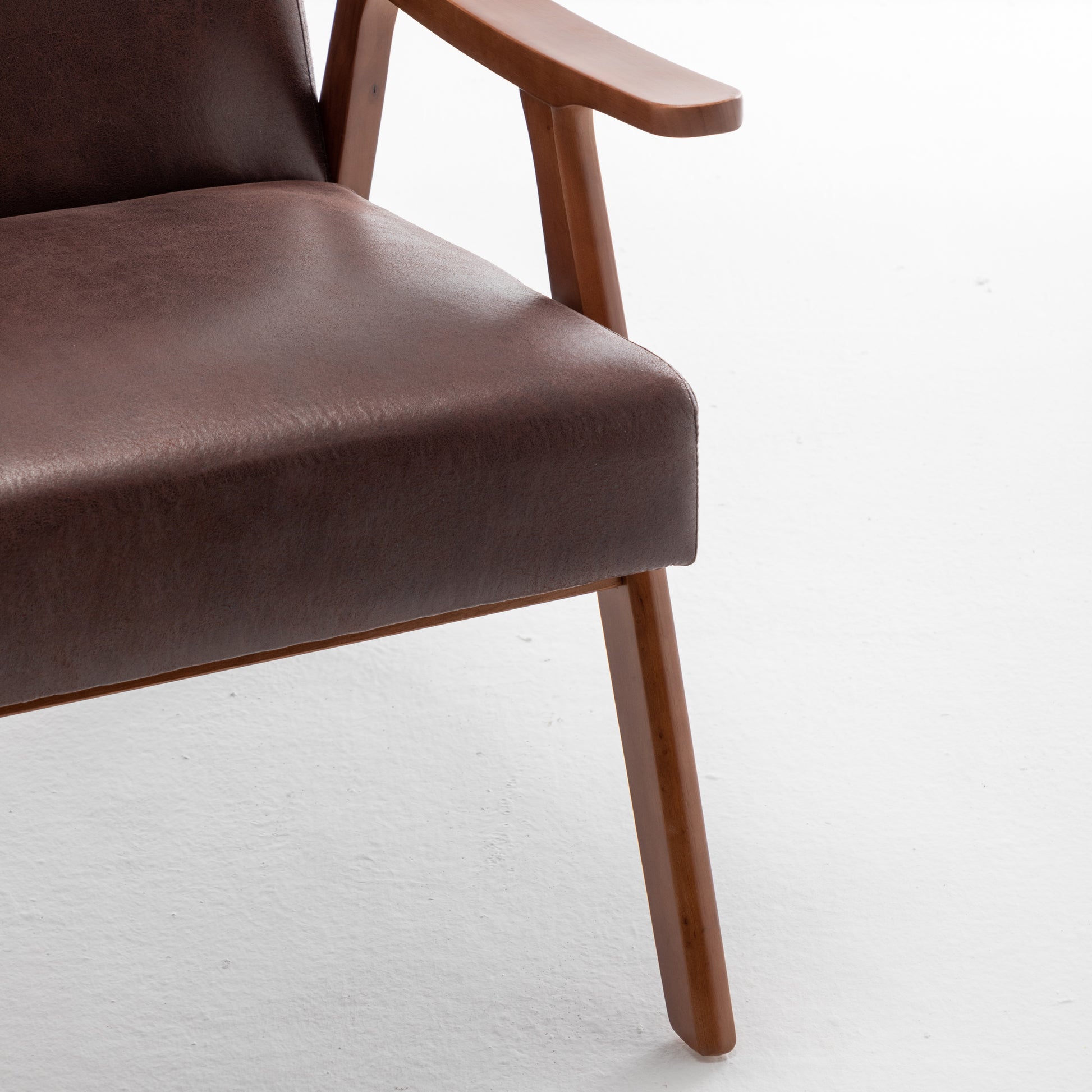 Brown faux leather armchair with wooden legs