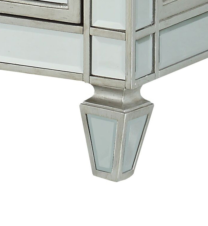Mirrored silver accent table leg with inlaid glass panels