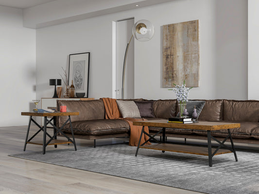 Brown leather sectional sofa with throw pillows and blankets