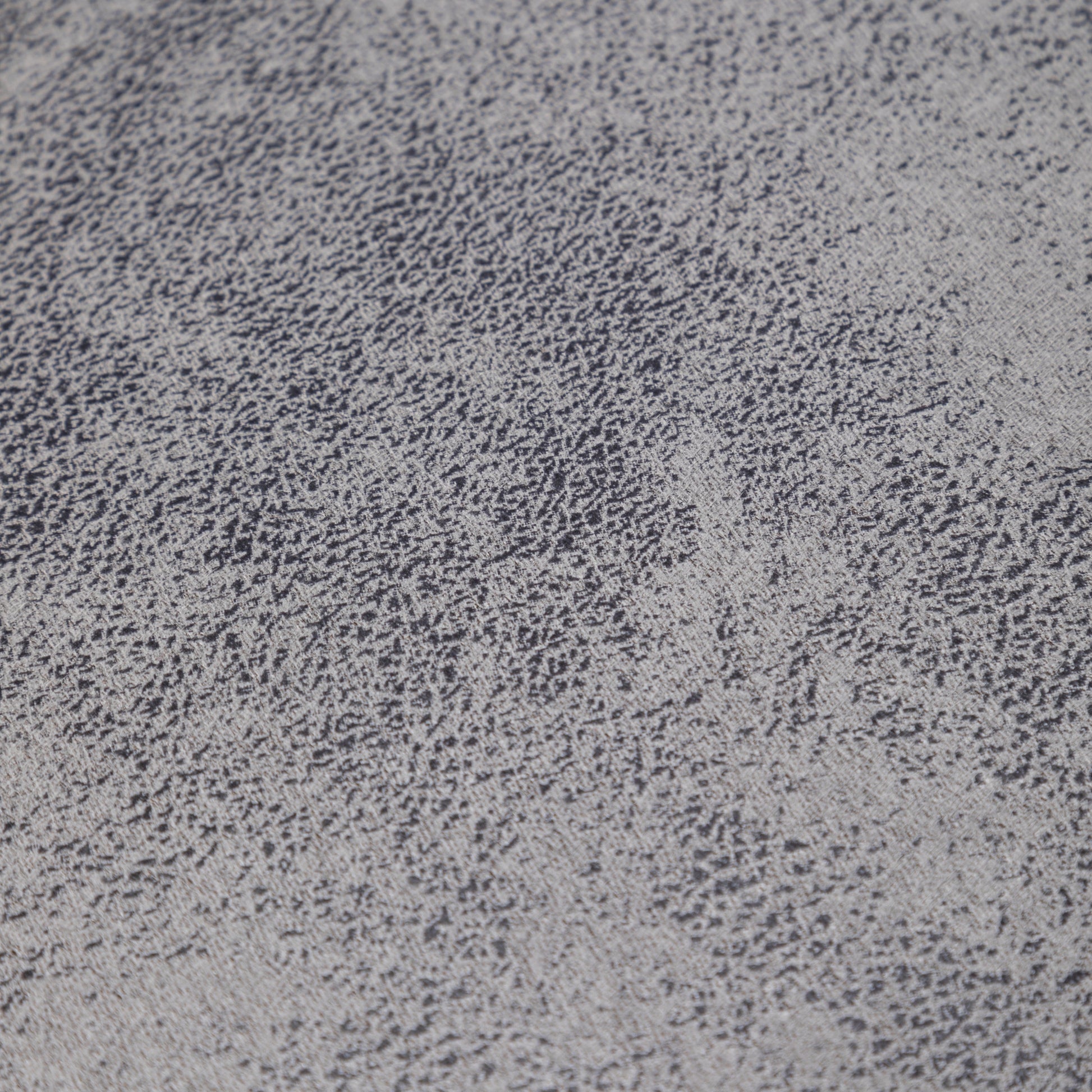 Textured grey fabric swatch with dark speckles