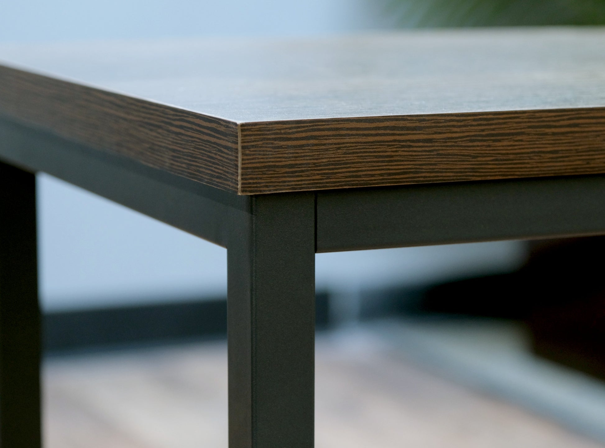 Dark wood grain tabletop with metal frame