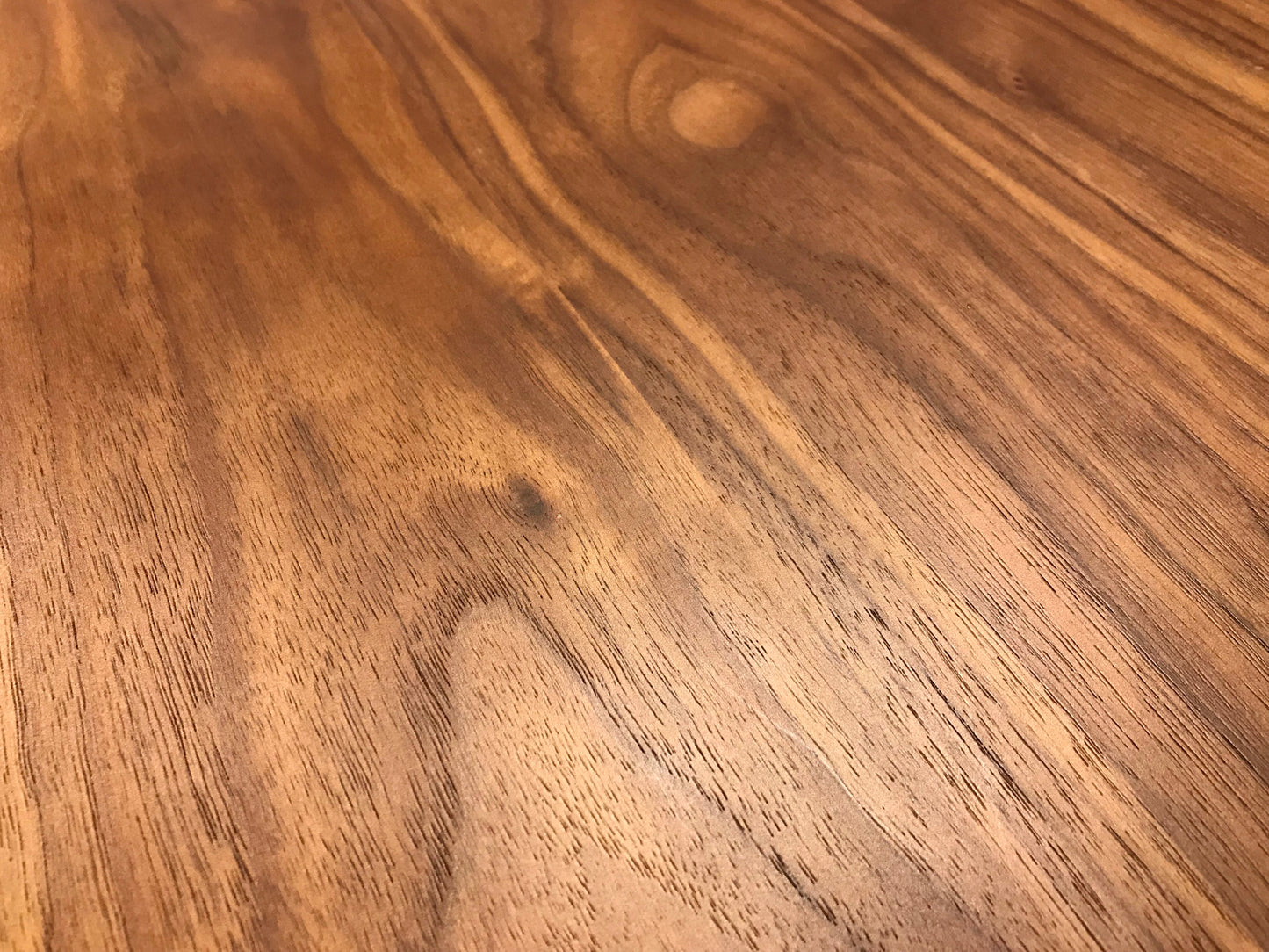 Closeup of rich walnut wood grain texture perfect for furniture