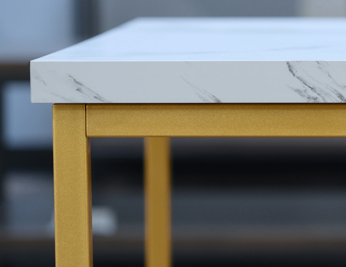 White faux marble tabletop with gold metal legs