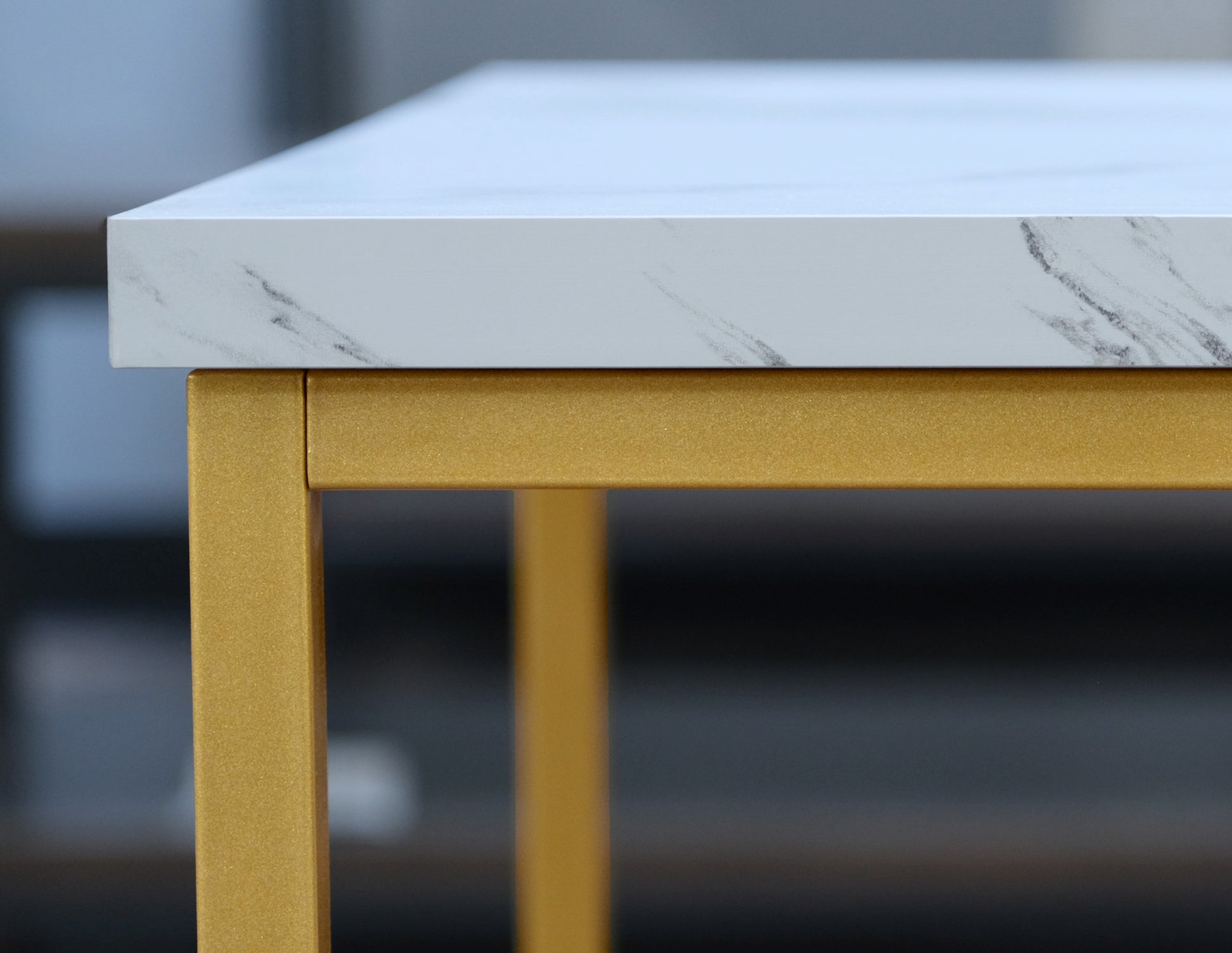 White faux marble tabletop with gold metal legs