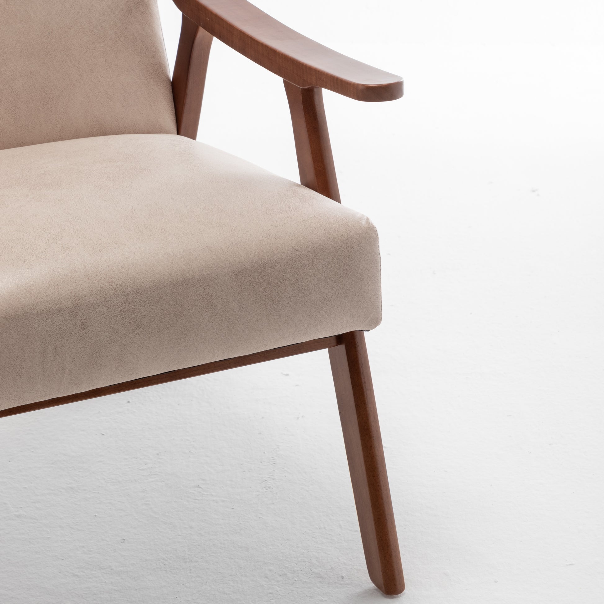 Beige upholstered armchair with wooden legs and armrest