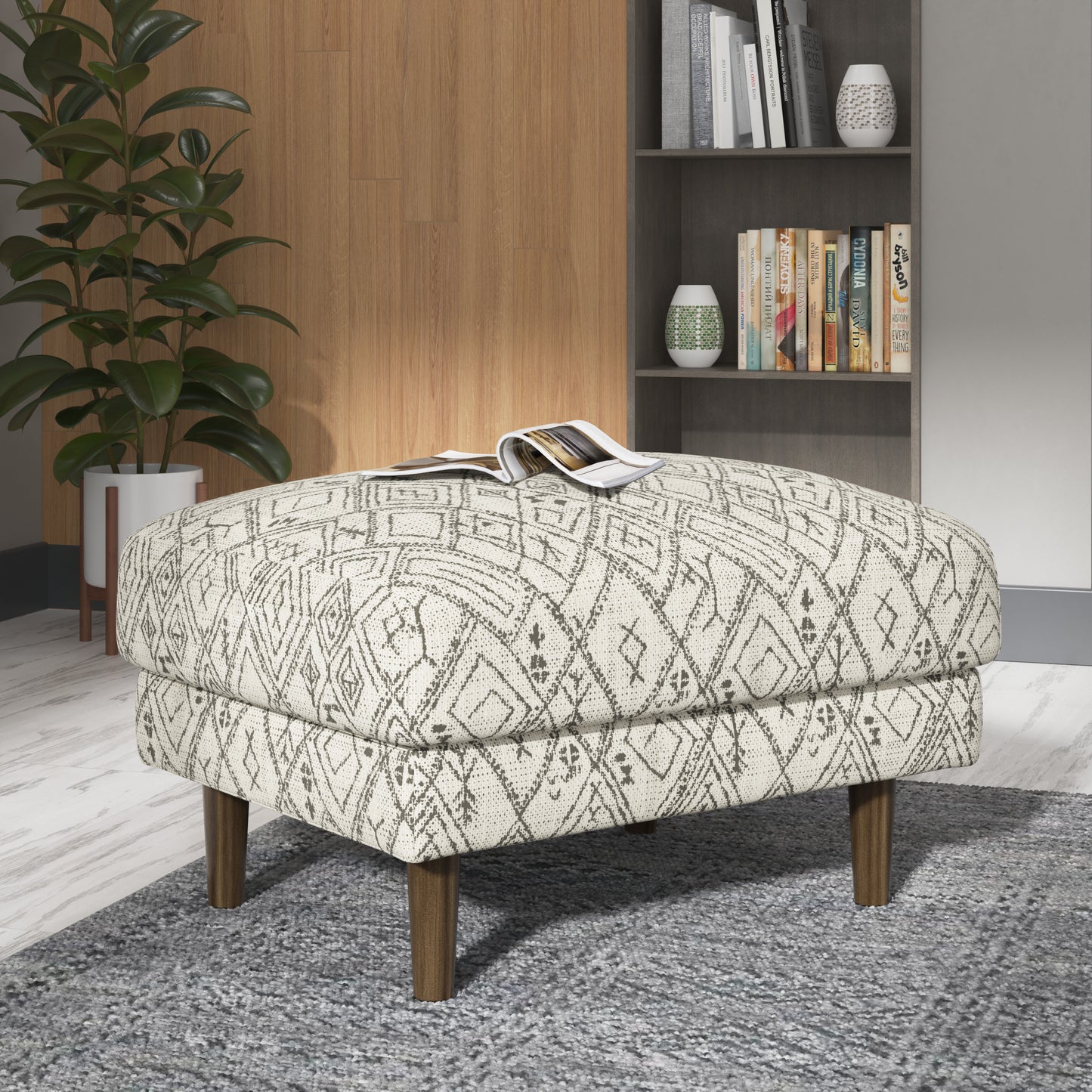 Geometric print ottoman with hardwood legs and upholstered finish