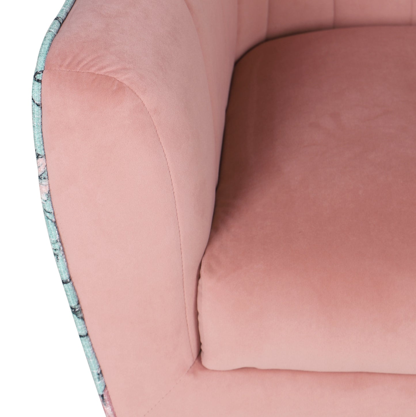 Closeup of a plush pink velvet armchair seat with subtle stitching details