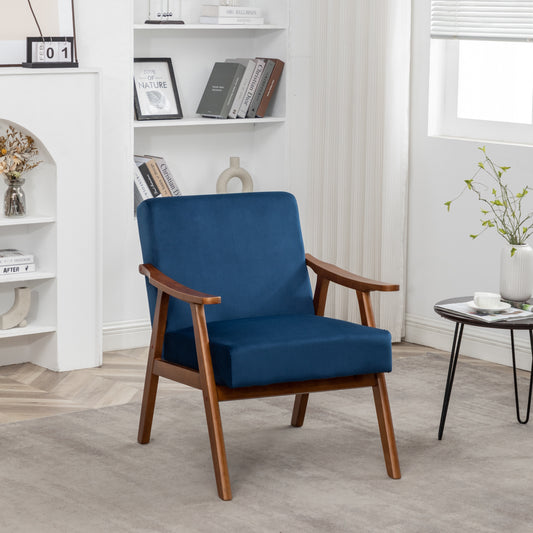 Deep blue velvet armchair with natural wood frame and arms