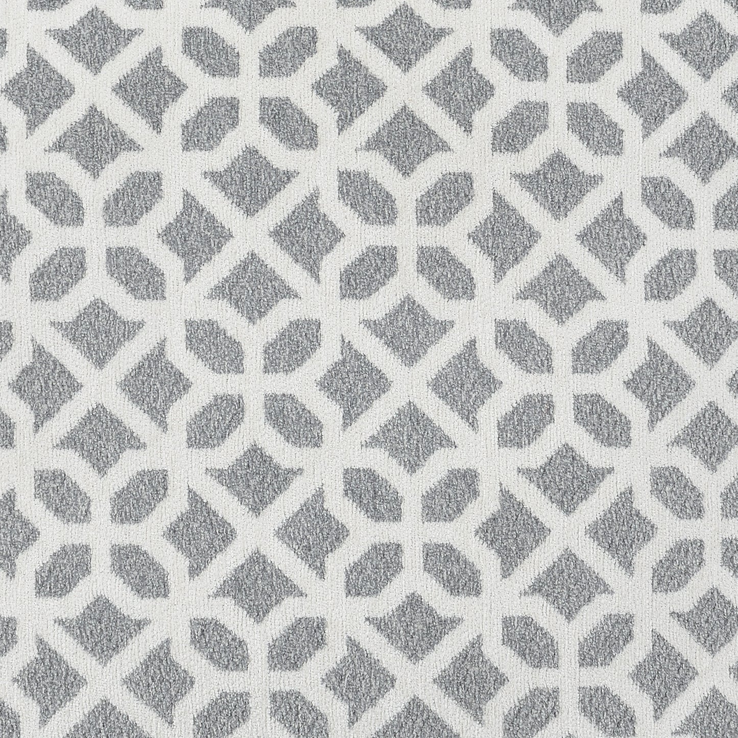 White and grey geometric patterned rug
