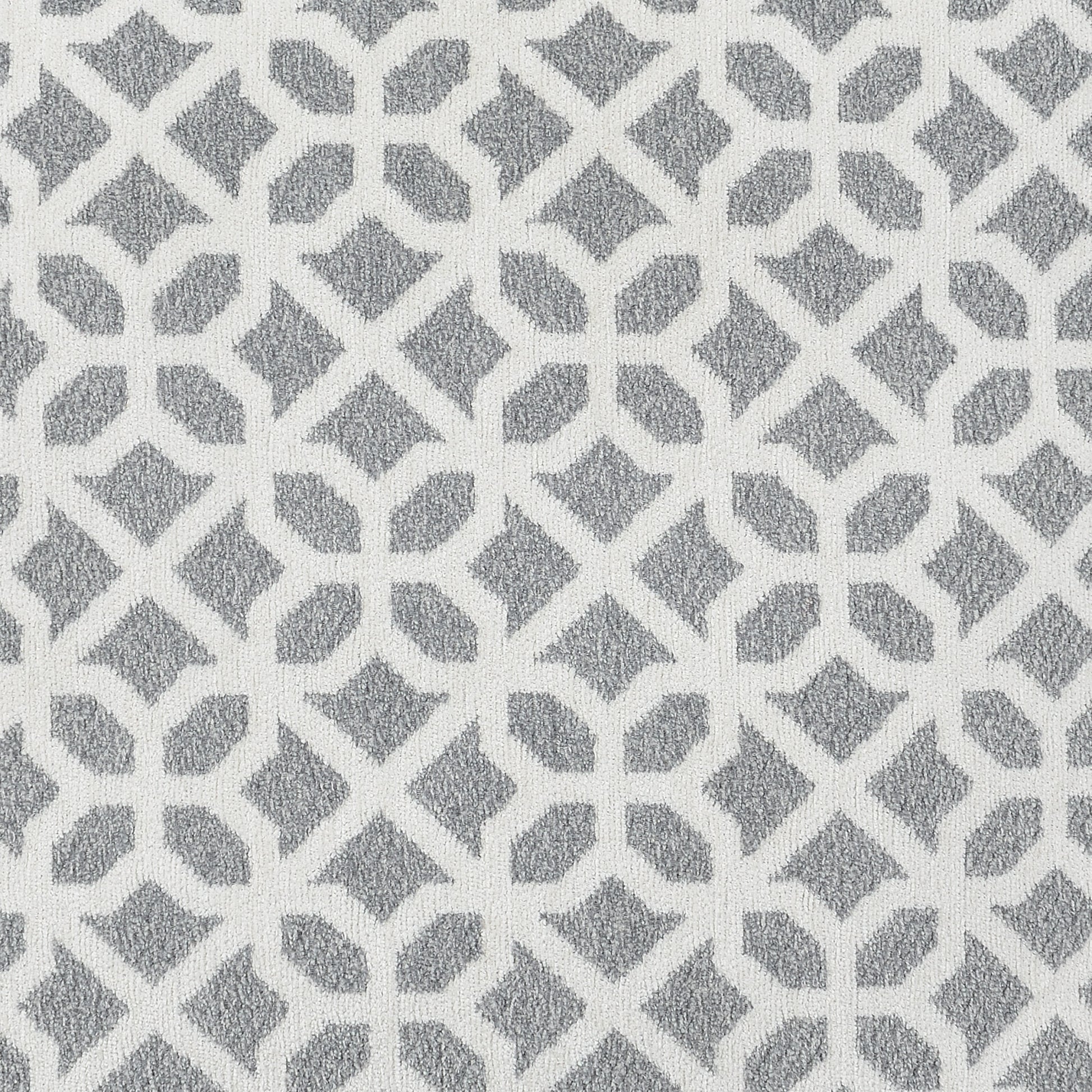 White and grey geometric patterned rug