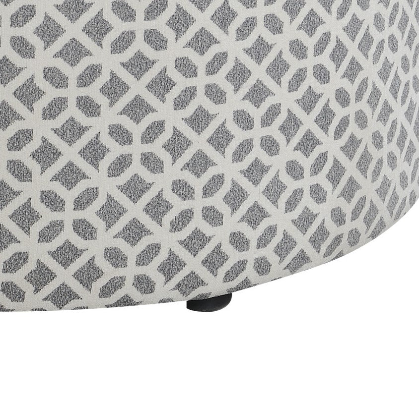 Round ottoman with white and gray geometric pattern
