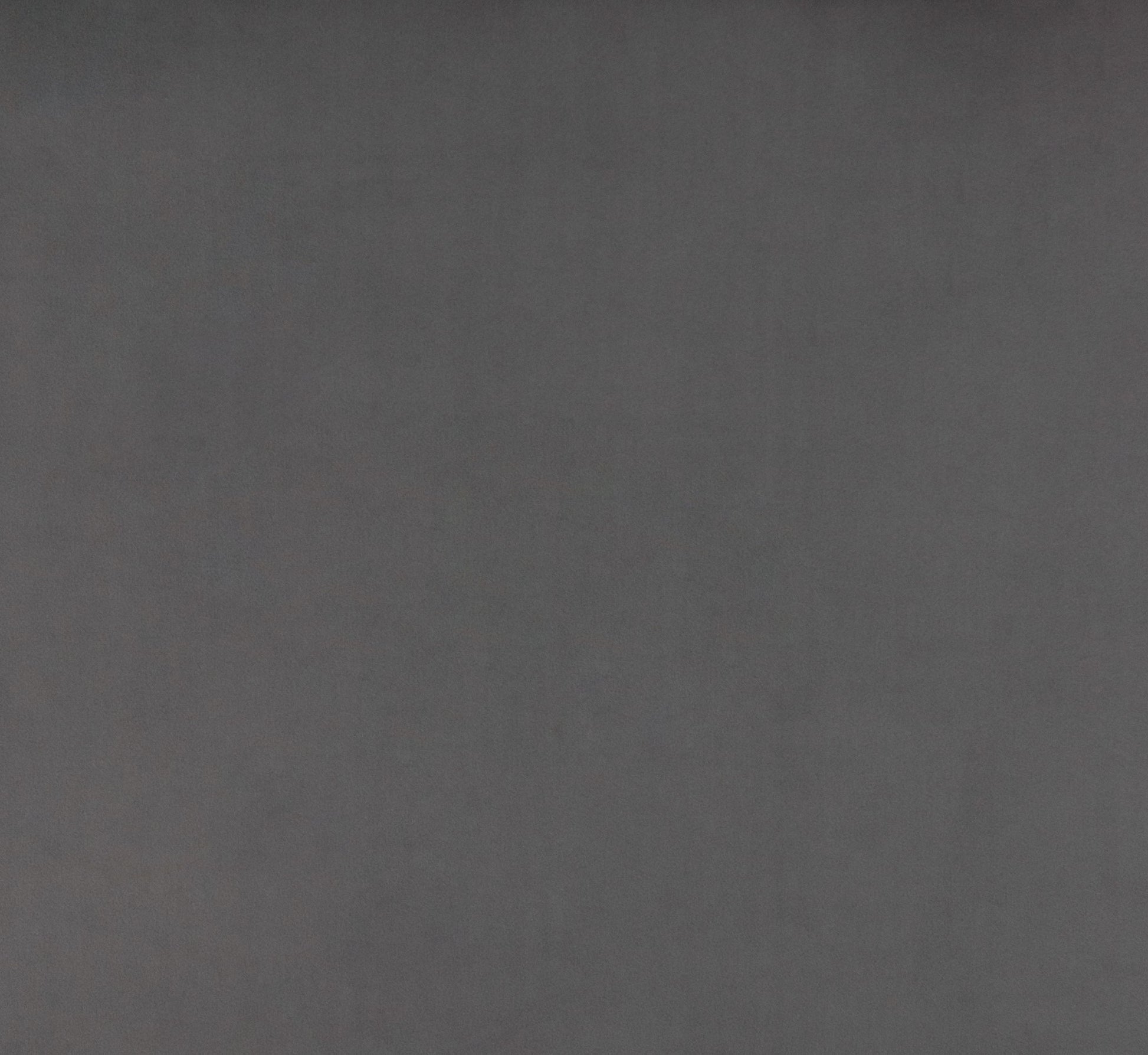 Dark charcoal grey textured fabric swatch for upholstery