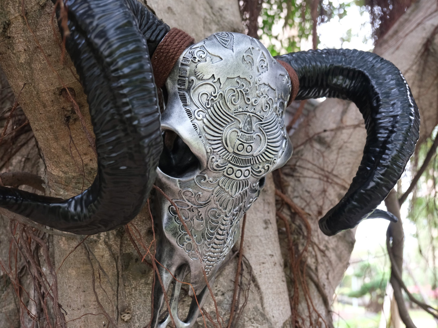 Ornate ram skull wall decor with intricate silver detailing