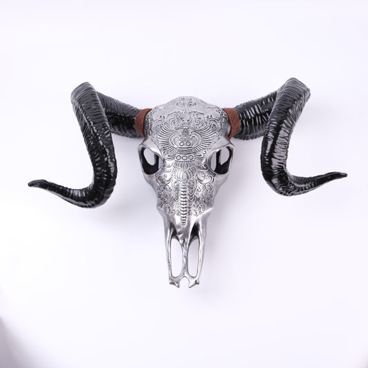 ornate silver ram skull with black horns