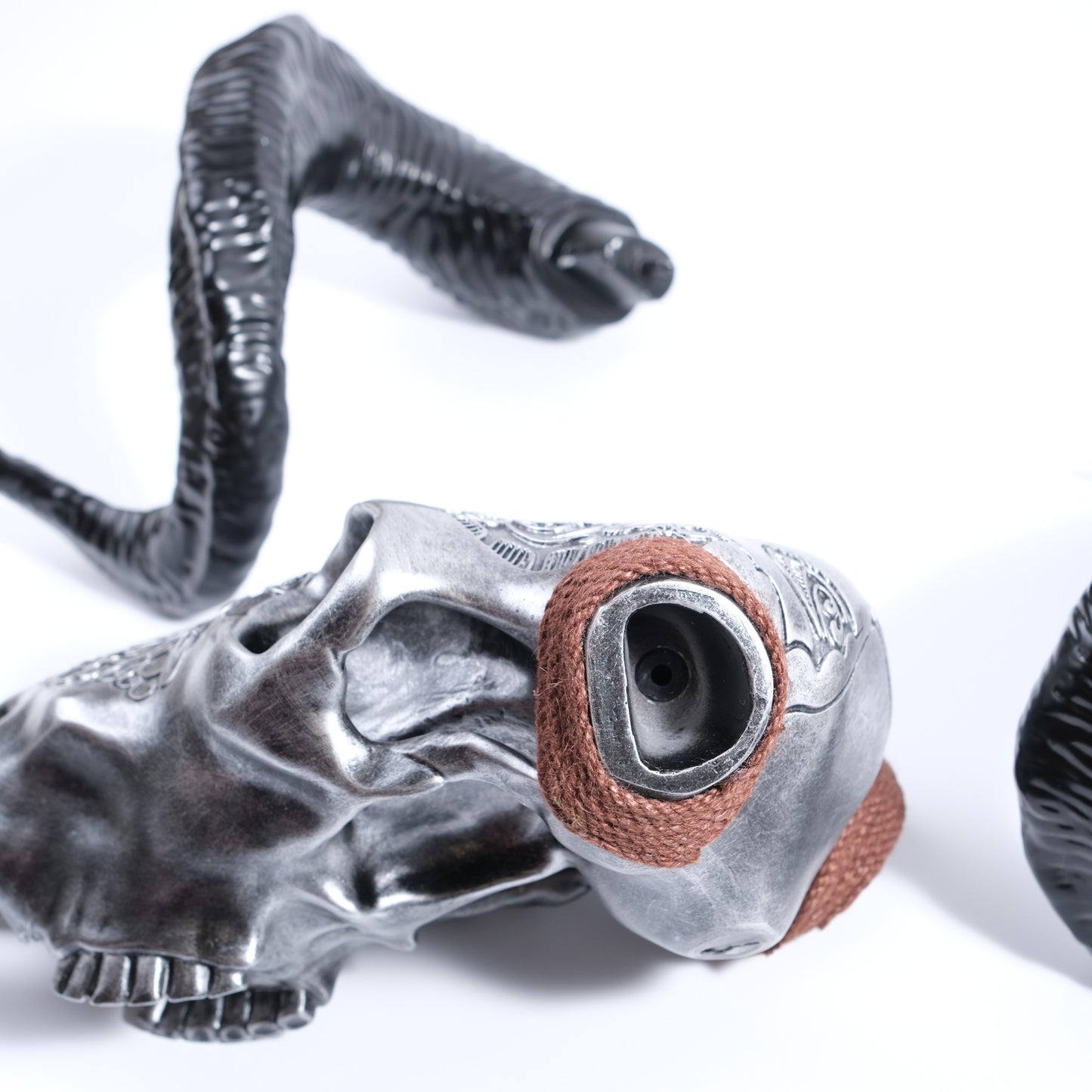 Silver ram skull with black horns