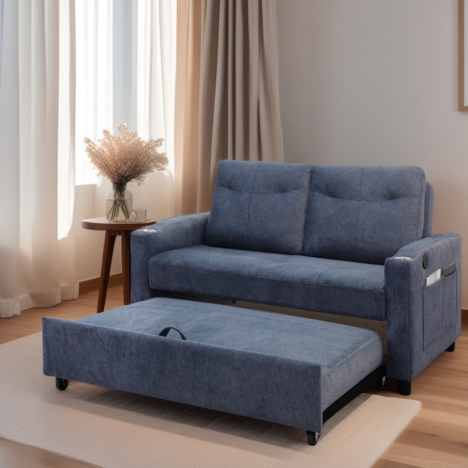 Blue fabric sofa bed with pullout ottoman and side pocket storage