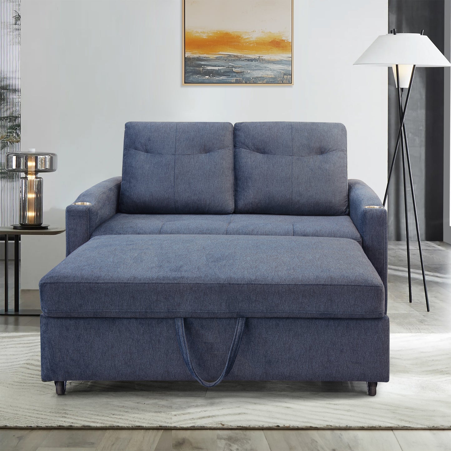 Dark blue upholstered sofa bed with chaise and builtin storage