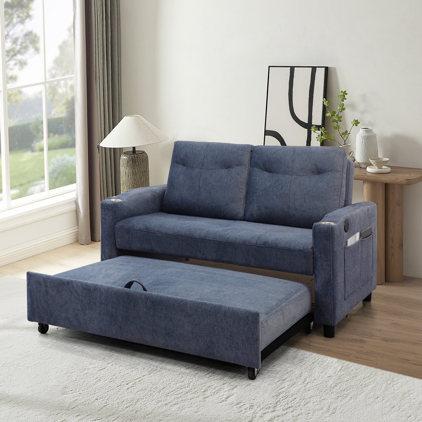 Blue fabric sofa bed with pullout ottoman and storage pockets