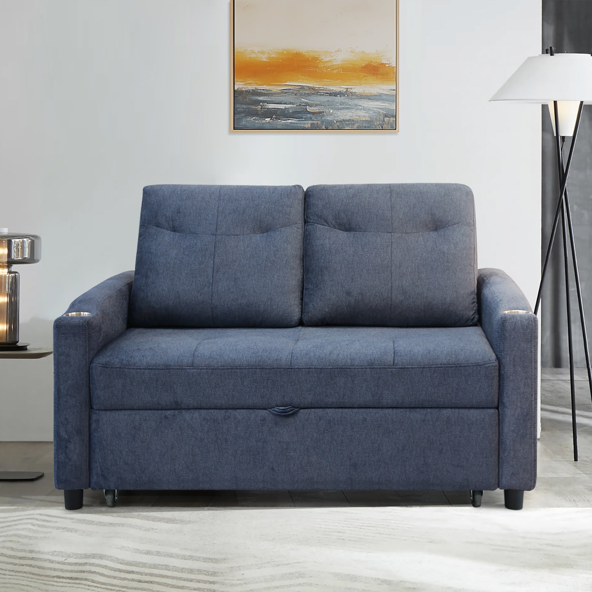 Blue fabric sofa bed with storage compartment