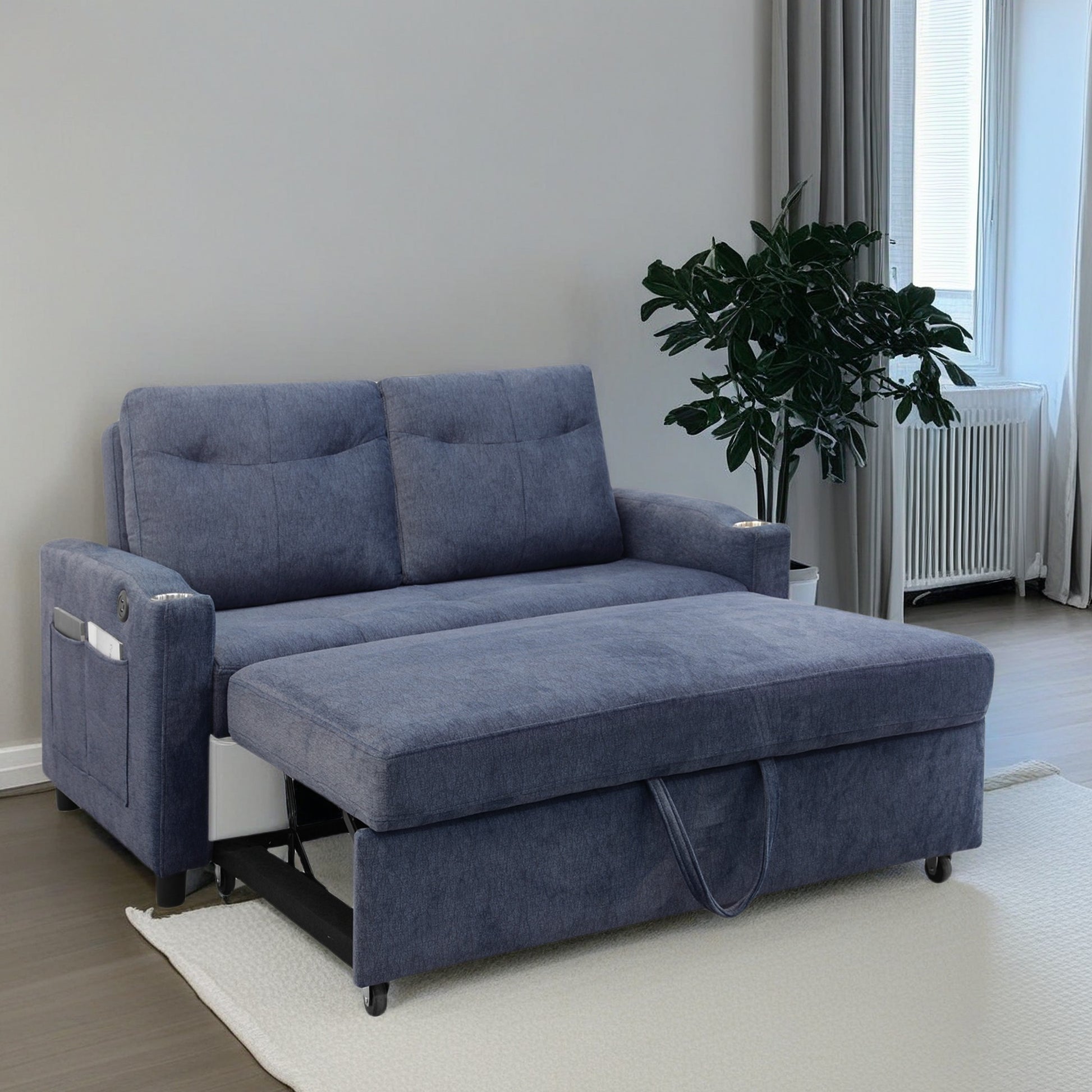 Navy blue sofa bed with pullout ottoman and storage pockets