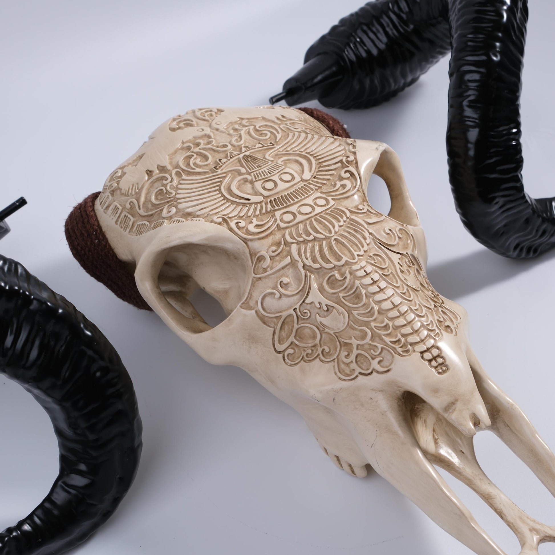 Ornate skull wall decor with detailed carvings and black horns