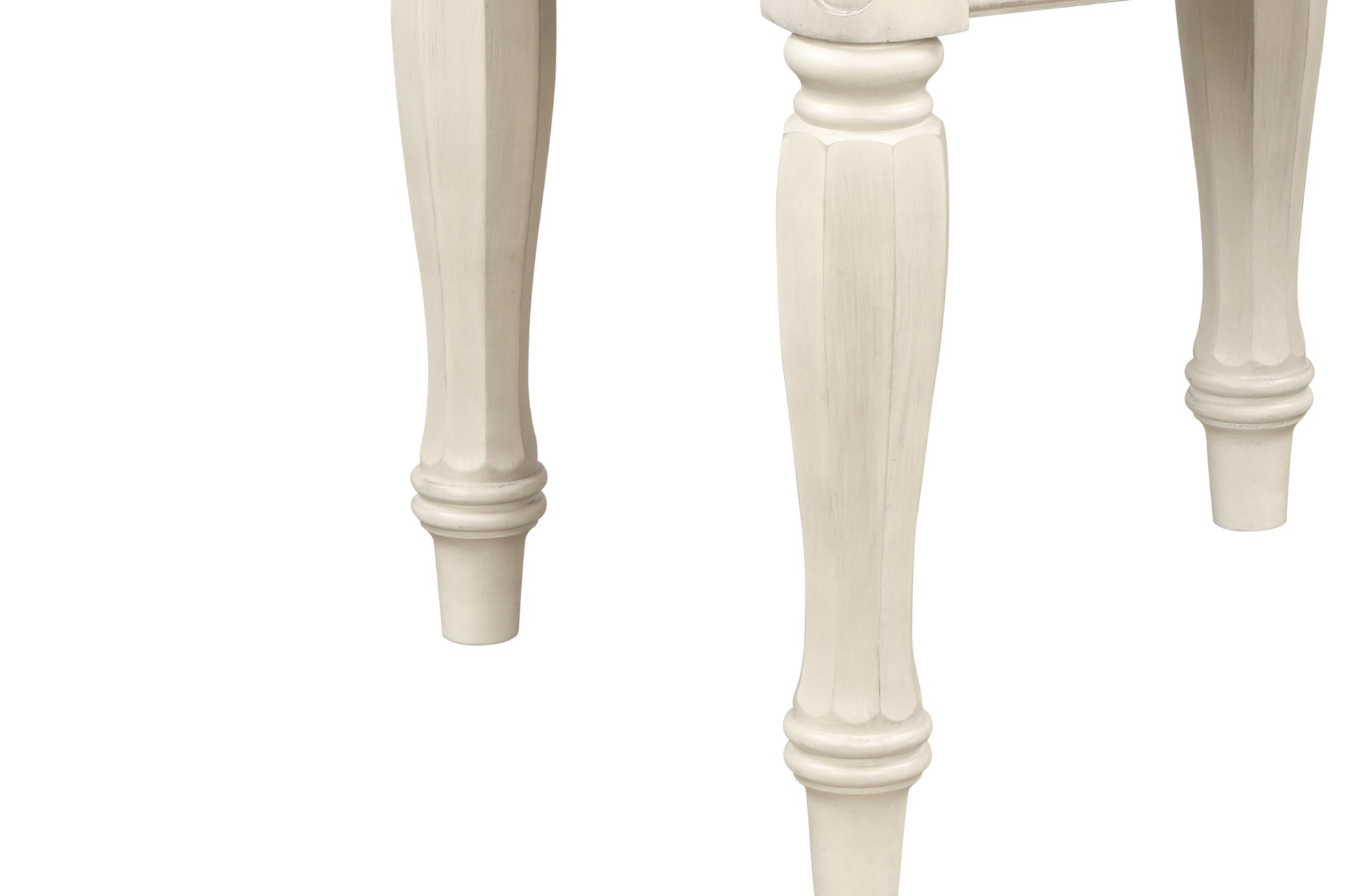 Ornate creamcolored table legs with fluted detailing