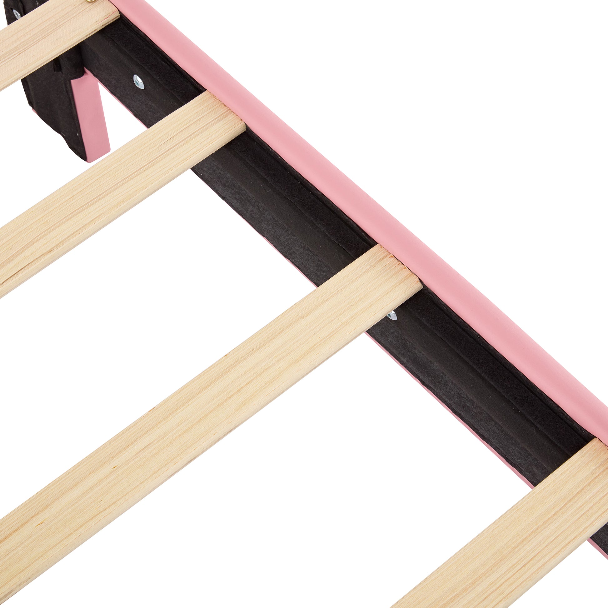 Closeup of pink upholstered bed frame with wooden slats