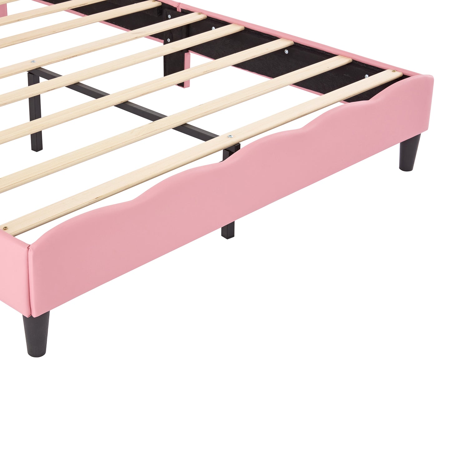 Pink upholstered twin bed frame with scalloped edges and wooden slats