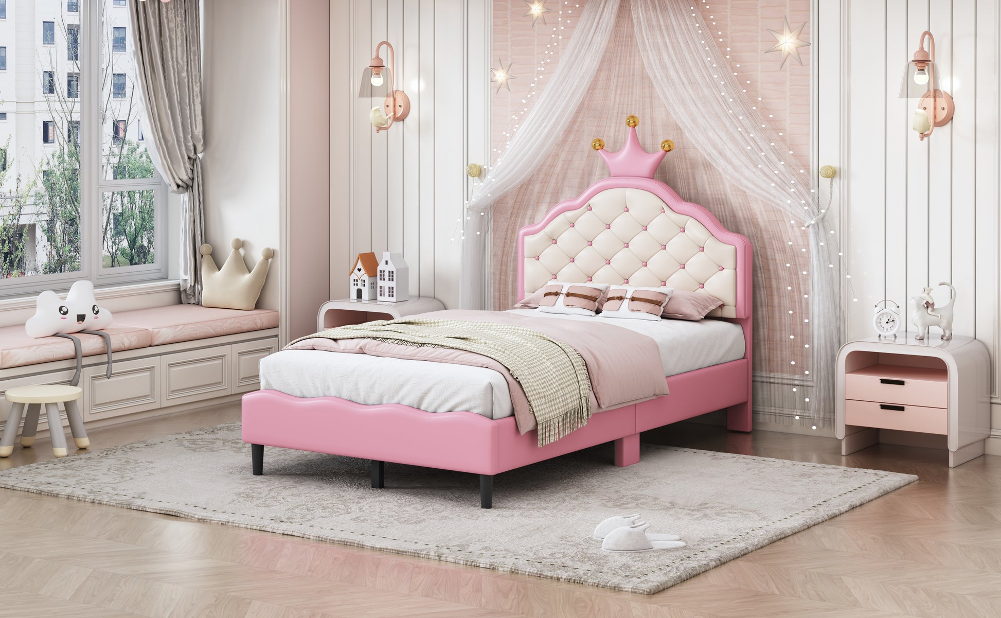 Pink upholstered toddler bed with crownshaped headboard and tufted details