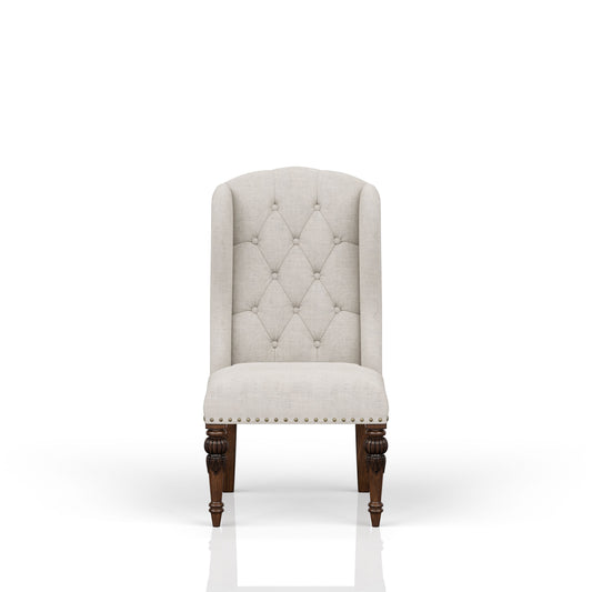 Upholstered dining chair with tufted back and nailhead trim