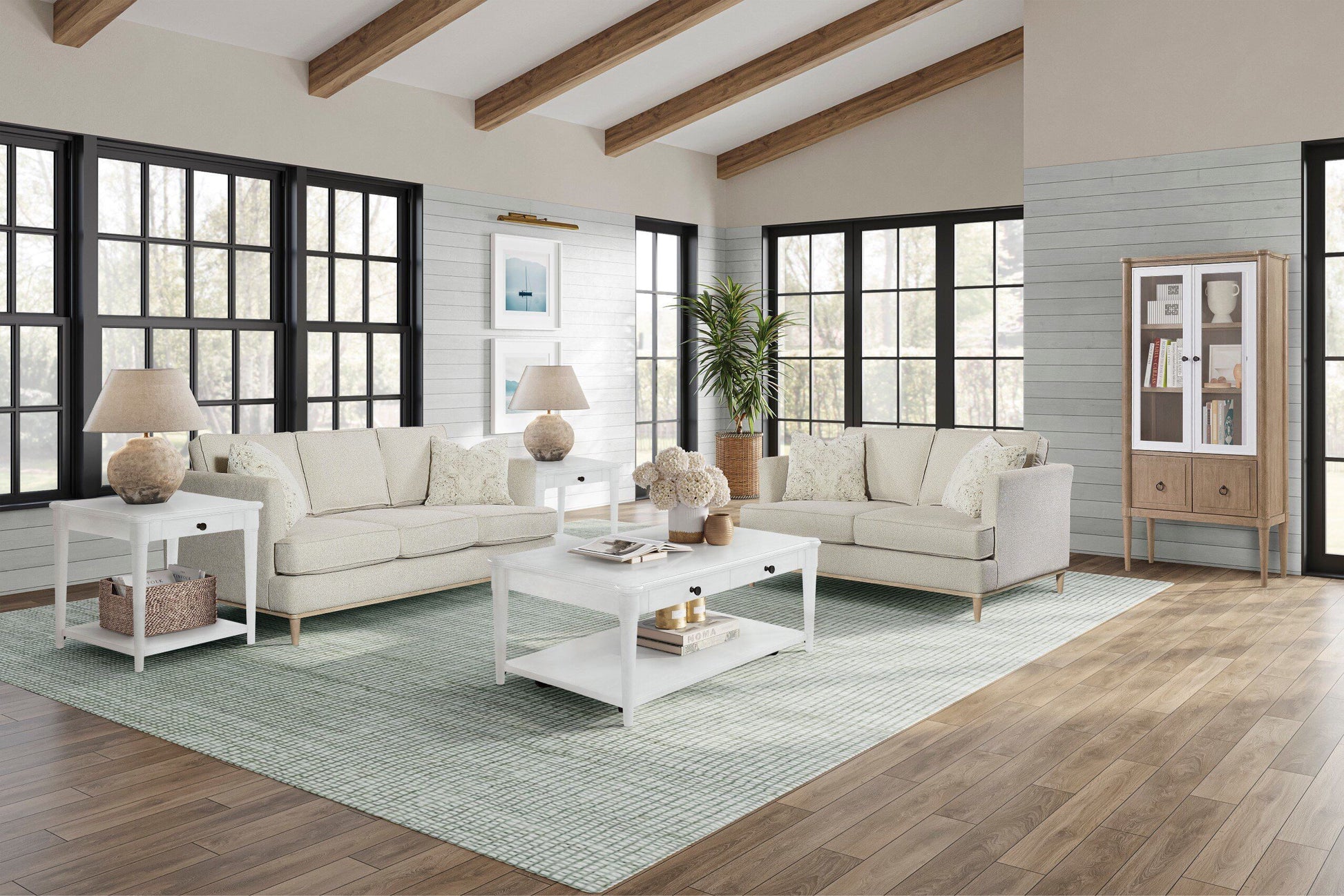 Cream upholstered sofa with decorative throw pillows