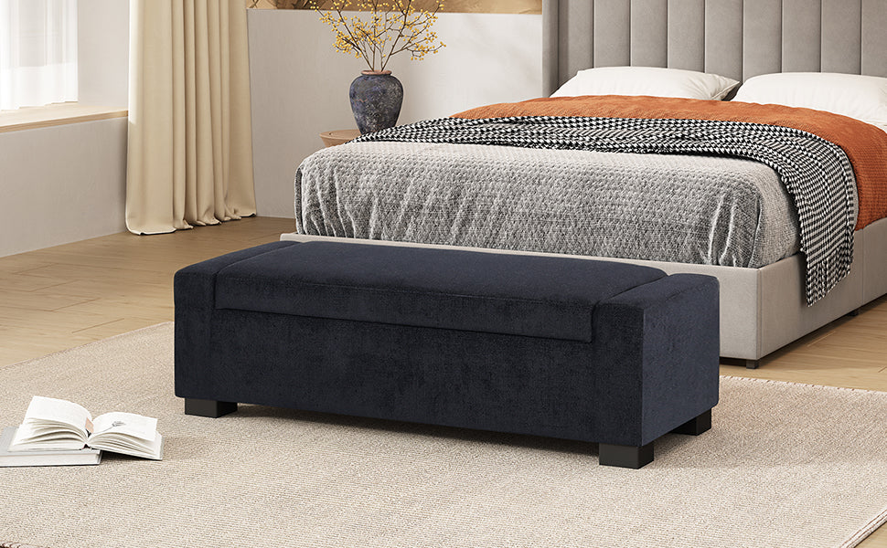 Dark navy upholstered storage bench with a lifttop