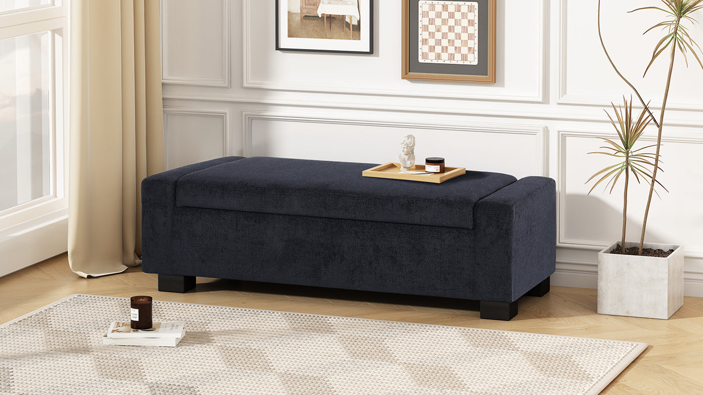 Dark navy upholstered storage ottoman with minimalist design