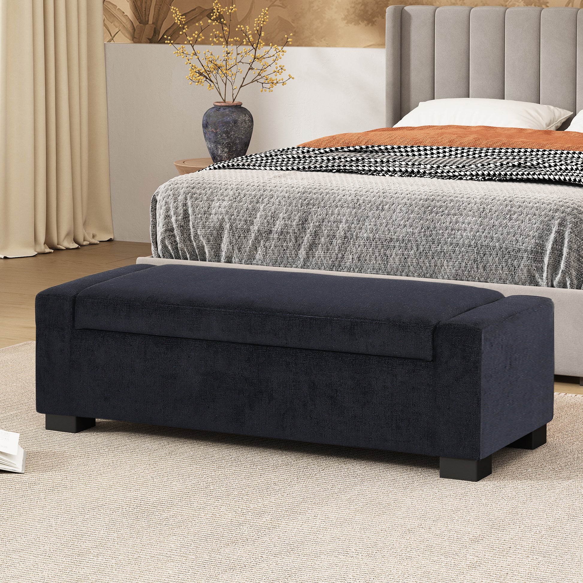 Dark navy storage bench with tufted lid and black legs