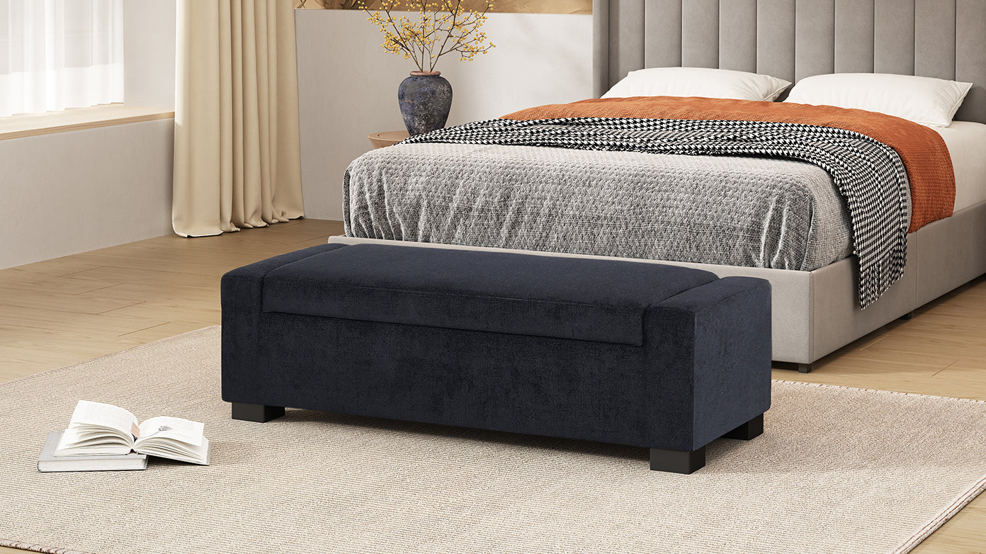 Dark navy upholstered storage ottoman with a hinged lid
